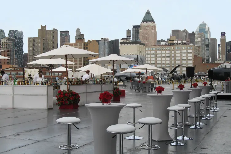 High top tables and stools with a large bar on the flight deck