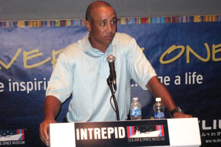 John Starks speaking to youth at the intrepid