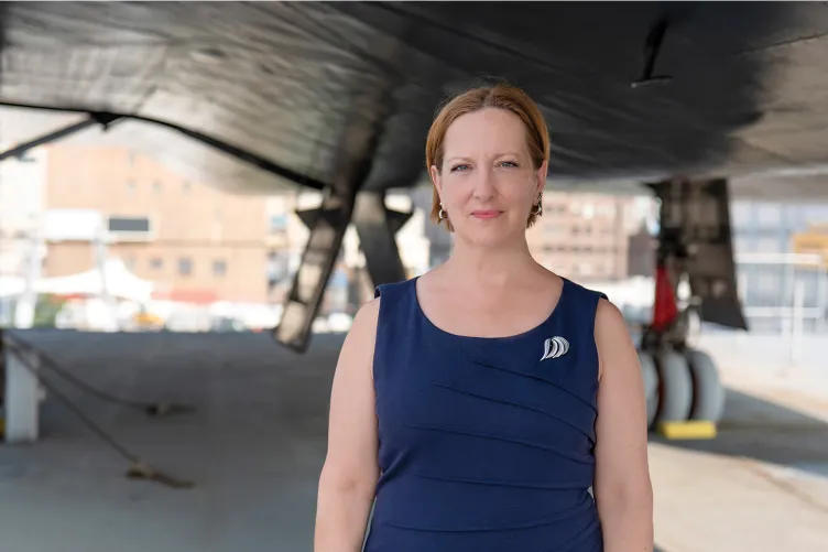 Headshot of Lynda Kennedy on the flight deck of Intrepid