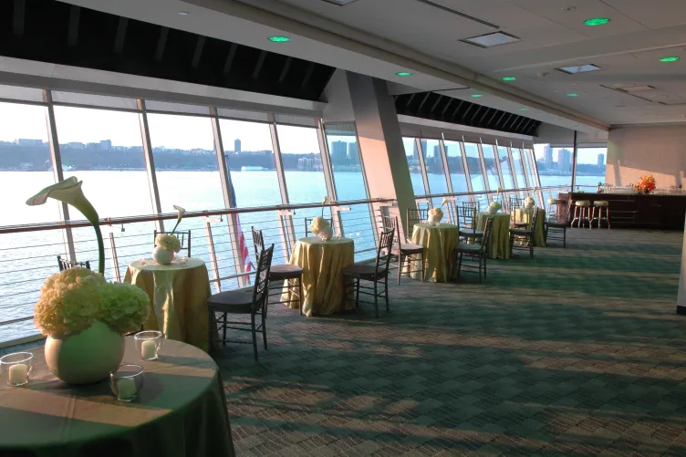 Great Hall set for a cocktail reception event with cocktail tables set near the window