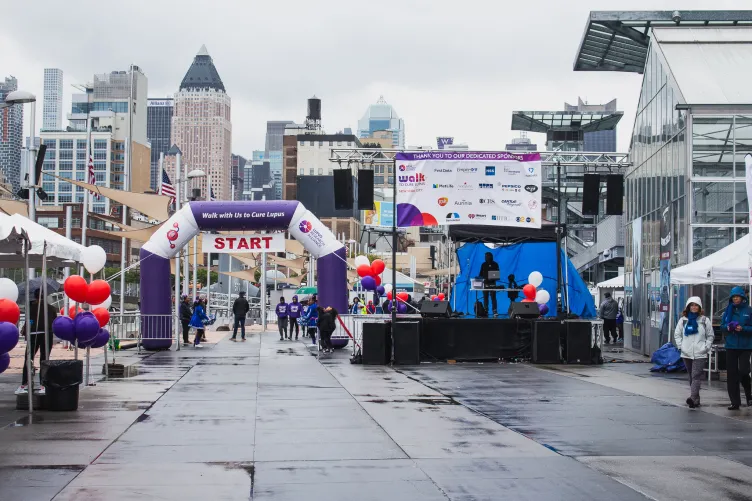 Fundraising walk with balloon archway and stage setup