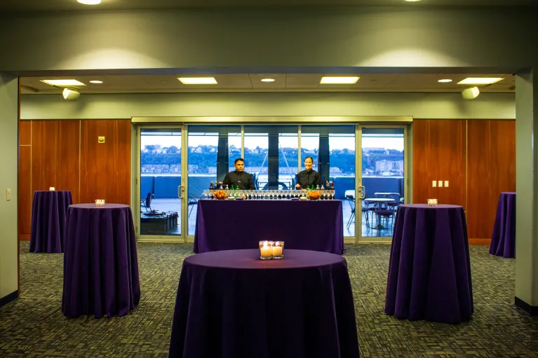 Round tables with chairs in the VIP Room extending out into the Fantail