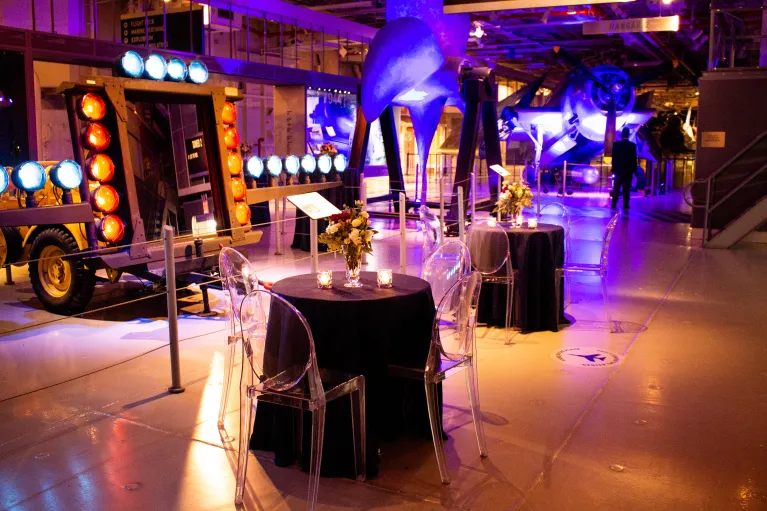 Hangar 1 cocktail reception low top tables with floral arrangements