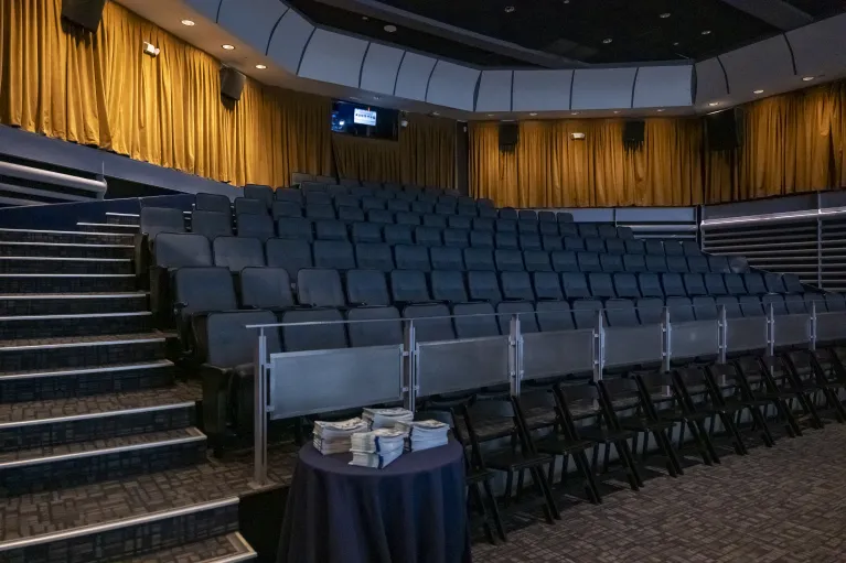 Theater seating facing large theater screen