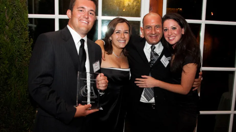 Intrepid Concierge Program Representative Jason Sullivan, Intrepid Director of Groups and Tourism Kim Wright, Vincent Timpone, VP Sales and Marketing for Davler Media and Intrepid Marketing Manager Desiree Scialpi following the Intrepid’s win.