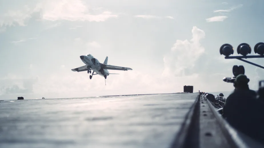 An airplane comes in to land on the flight deck.