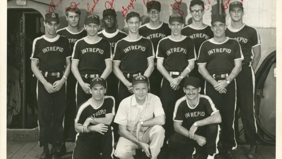 Signed photo of Intrepid’s softball team posting with the ship’s captain.