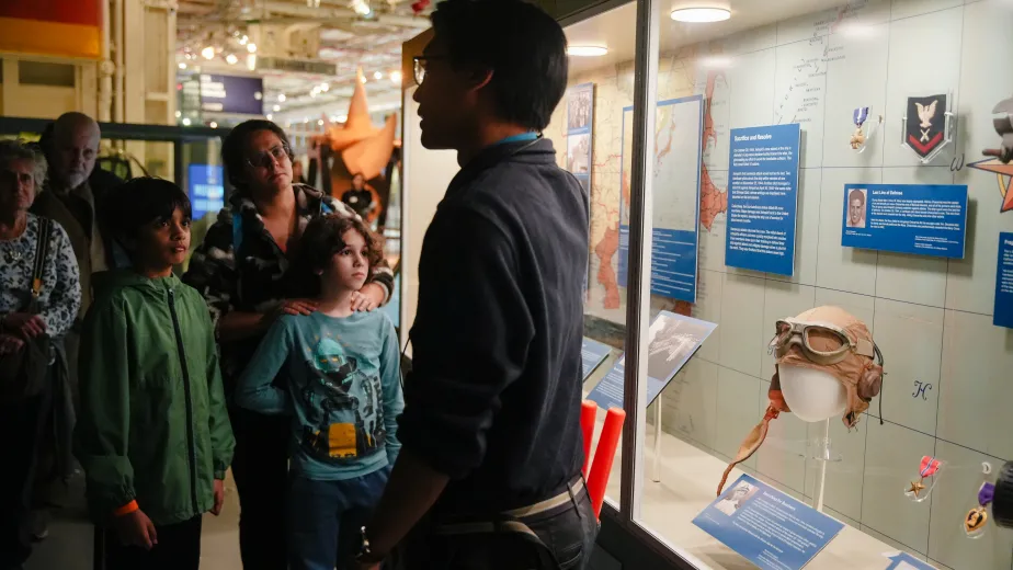 A group of visitors at the museum participating in a group tour.